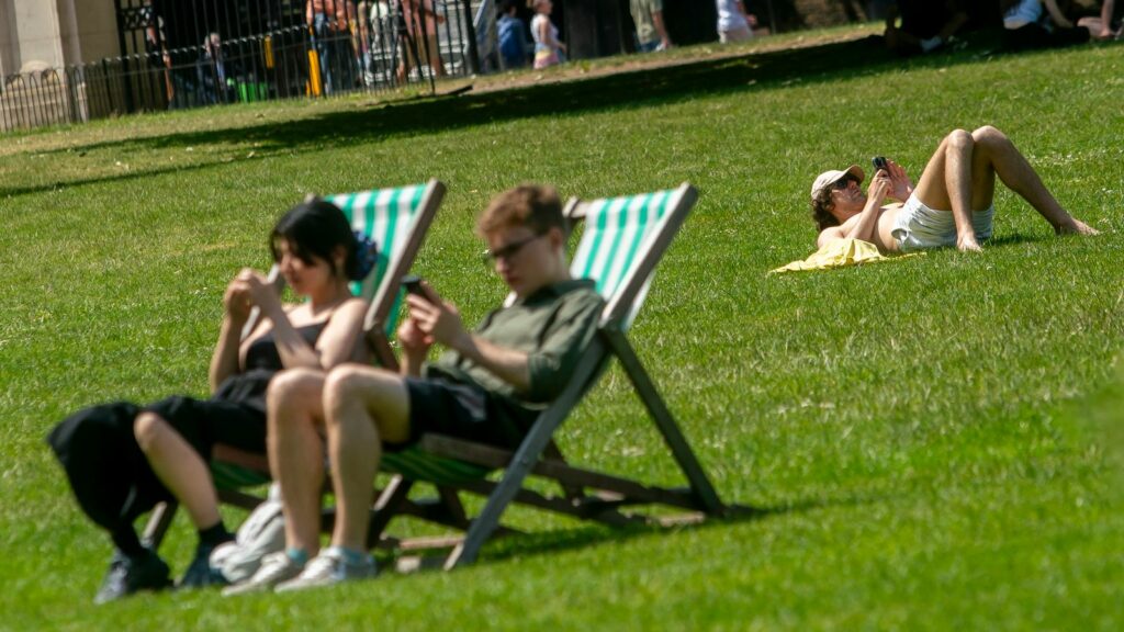 Sunbathers in Green Park, London. File pic: PA