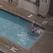 Disturbing moment woman drowns in shallow end of Las Vegas pool while clutching handrail... as swimmers walk past her