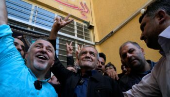 Iranian reformist wins presidency, beating a prominent hard-liner