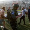 Israel hits Hezbollah targets in Lebanon after deadly football pitch attack