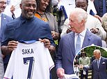 King Charles and Idris Elba show their support for the Three Lions as they beam in photos holding England shirts - after royal's playful plea for team to secure a drama-free victory in the Euros final