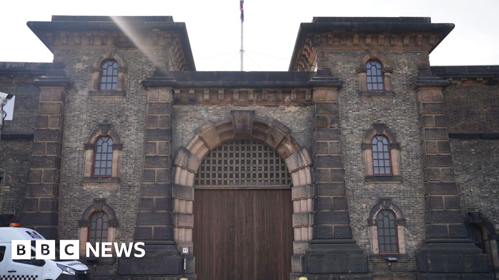 Prison officer in court over sex in cell video