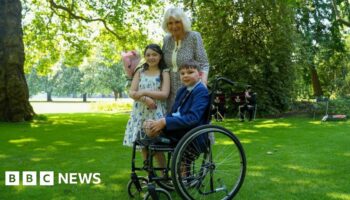 Queen Camilla hosts boy who missed garden party