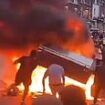 Riot thugs torch bus and wreck police car on night of shame in Leeds: Residents are told to stay indoors as huge mob tears through streets following stand-off with dozens of officers