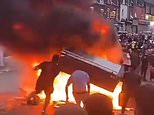 Riot thugs torch bus and wreck police car on night of shame in Leeds: Residents are told to stay indoors as huge mob tears through streets following stand-off with dozens of officers