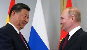 Smiling Putin meets with 'old pal' President Xi in power move against West