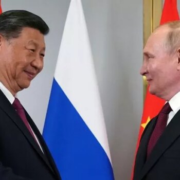 Smiling Putin meets with 'old pal' President Xi in power move against West