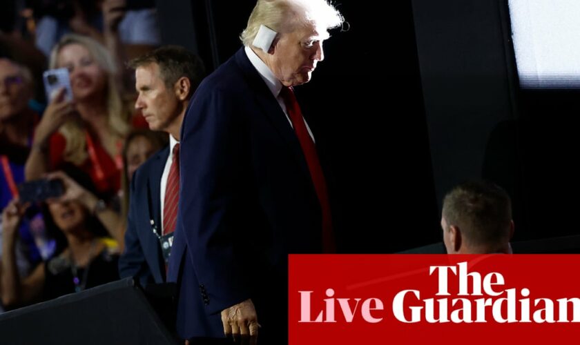 Trump joins crowd at Republican convention hall with bandaged ear, in first public appearance assassination attempt – live