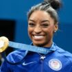 Simone Biles shows off her gold medal. Pic: Pete Dovgan/Speed Media/Icon Sportswire/AP