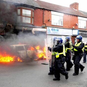 A car was set on fire by rioters in Middlesbrough on Sunday 4 August. Pic: PA