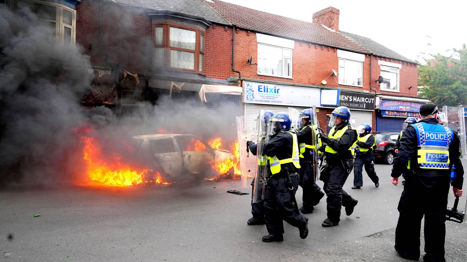 A car was set on fire by rioters in Middlesbrough on Sunday 4 August. Pic: PA