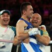 Paris 2024 Olympics - Boxing - Men's 51kg - Final - Roland-Garros Stadium, Paris, France - August 08, 2024. Hasanboy Dusmatov of Uzbekistan celebrates with coaching staff after winning against Billal Bennama of France. REUTERS/Maye-E Wong