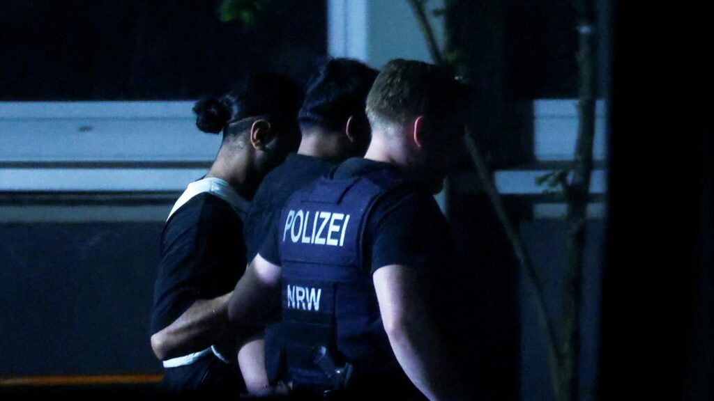 Police officers detain a person in Solingen, Germany. Pic: Reuters