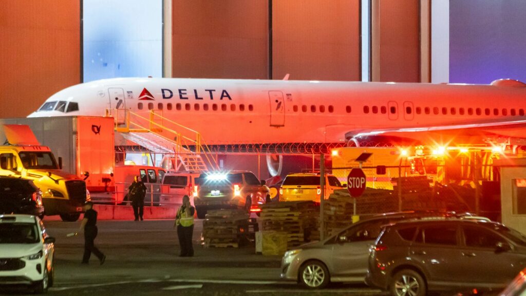 Multiple Atlanta Fire Rescue Department units and police park outside a Delta Maintenance facility near Hartsfield-Jackson International Airport early Tuesday, Aug. 27, 2024 in Atlanta. (John Spink/Atlanta Journal-Constitution via AP)