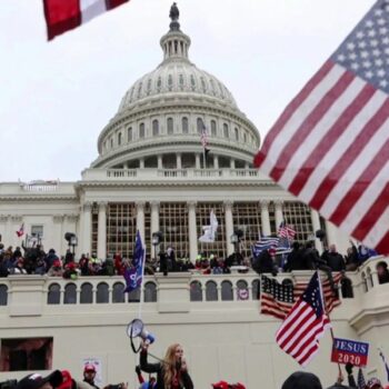 capitol with protesters in front