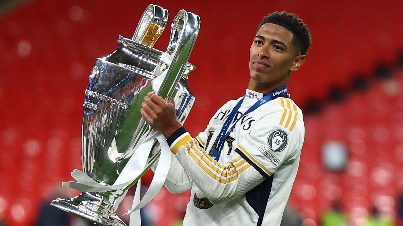 Soccer Football - Champions League - Final - Borussia Dortmund v Real Madrid - Wembley Stadium, London, Britain - June 1, 2024 Real Madrid's Jude Bellingham celebrates with the trophy after winning the Champions League REUTERS/Hannah Mckay