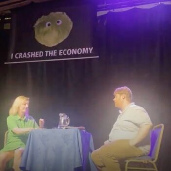 Liz Truss storms off stage after talk interrupted by lettuce banner prank