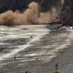 Moment thousands of rocks crash onto popular tourist spot just yards from beachgoers