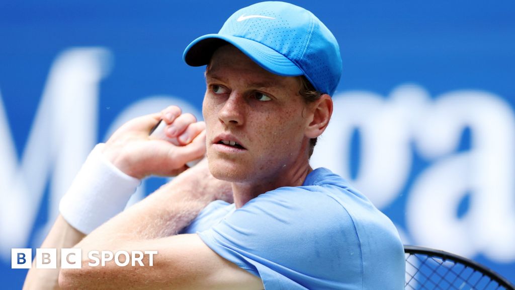 Jannik Sinner hits the ball at a practice session