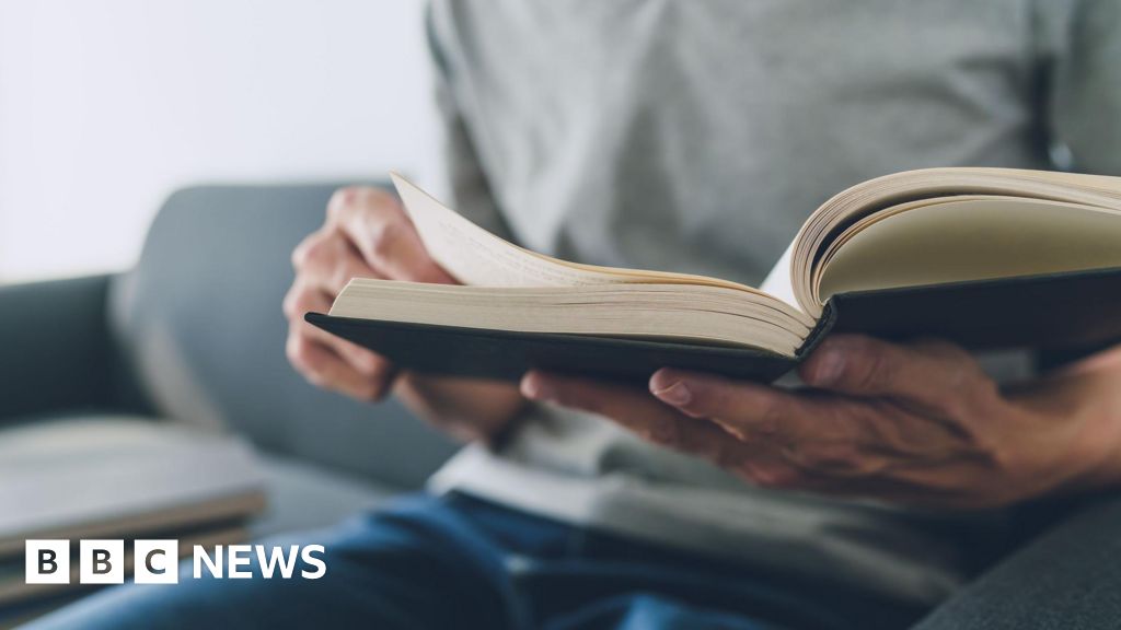 Suspected burglar caught after sitting down with book