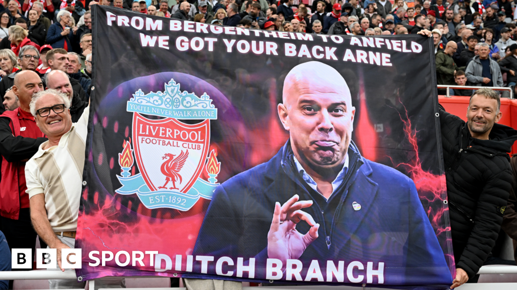 Liverpool fans hold up a banner before Arne Slot's first Premier League game at Anfield