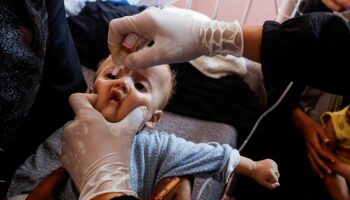 A Palestinian child is vaccinated against polio. Pic: Reuters