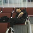 France, Ile-de-France, Seine-et-Marne, Roissy Airport, man sleeping in the waiting lounge. (Photo by Martin/JTP / Photononstop / Photononstop via AFP)