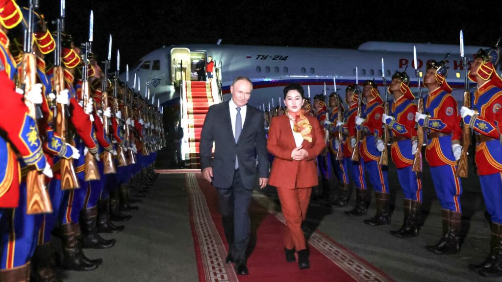 Russian President Vladimir Putin, on red carpet left, walks next to Mongolian Foreign Minister of Mongolia, Batmunkh Battsetseg upon his arrival at Ulaanbaatar's International airport Chinggis Khaan, late Monday, Sept. 2, 2024. (Natalia Gubernatorova, Sputnik, Kremlin Pool Photo via AP)