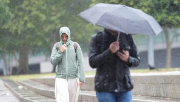 Britons caught in Storm Lilian this month during what was the coolest summer in years. Pic: PA