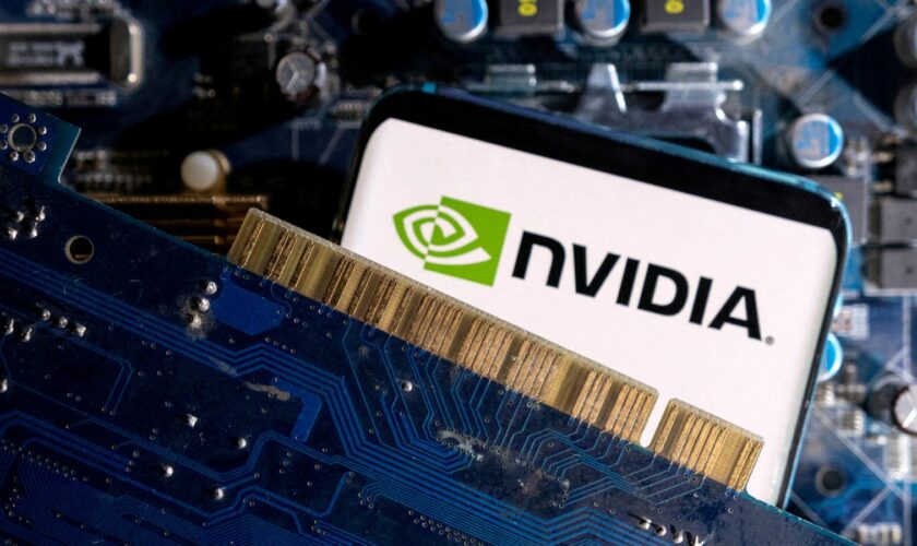 FILE PHOTO: A smartphone with a displayed NVIDIA logo is placed on a computer motherboard in this illustration taken March 6, 2023. REUTERS/Dado Ruvic/Illustration/File Photo