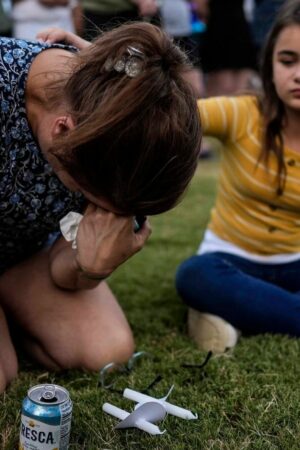 Brandy Rickaba and her daughter Emilie during a candlelight vigil for the victims of the school shooting. Pic: AP