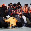 Migrants attempting to cross the English Channel to reach Britain get on an inflatable dinghy as the French police and gendarmes officers patrol on the beach of the Slack dunes in Wimereux, France, September 4, 2024. REUTERS/Benoit Tessier TPX IMAGES OF THE DAY