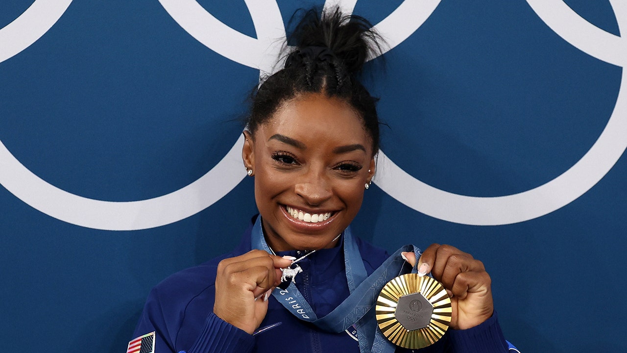 Simone Biles acknowledges diamond-studded GOAT necklace 'p---es people off'