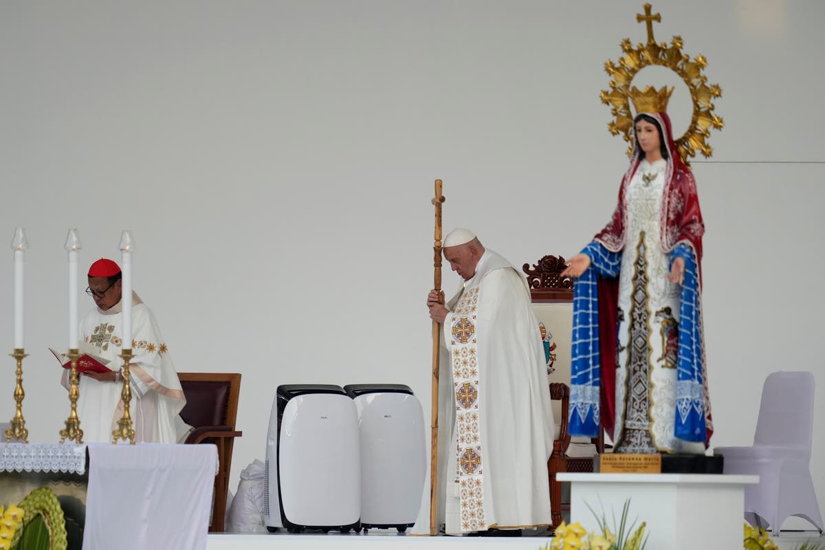 Pope heads to Papua New Guinea after final Mass in Indonesia before an overflow crowd of 100,000