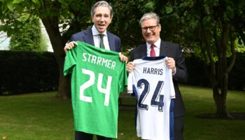 Sir Keir Starmer and Irish Taoiseach Simon Harris exchange football shirts in Dublin on Saturday. Pic: PA