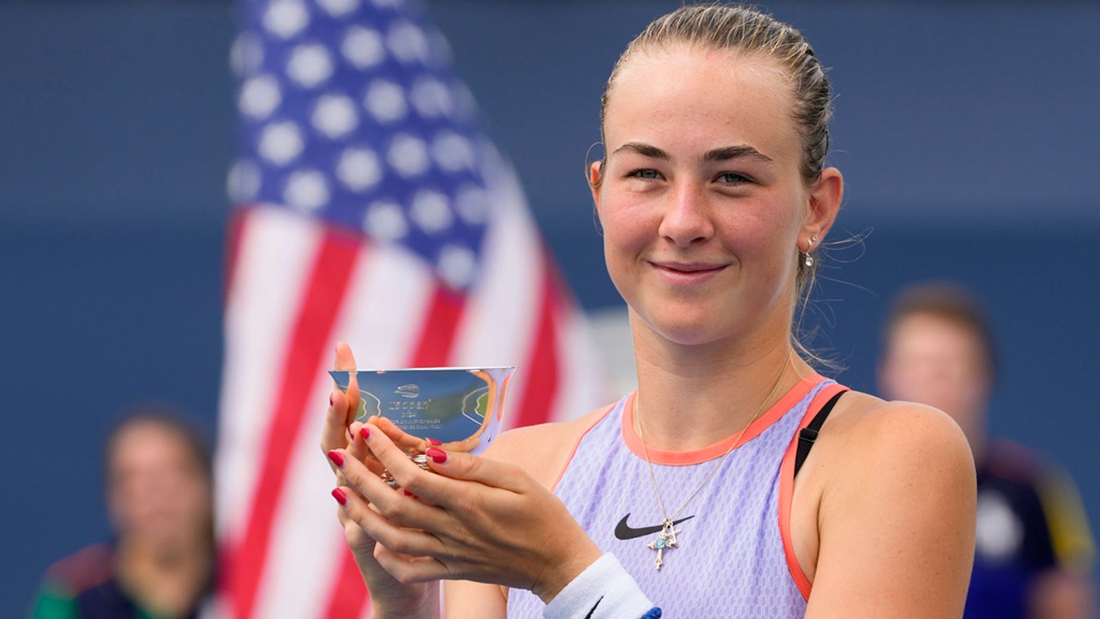 Mika Stojsavljevic holds up the championship cup after winning the final. Pic: AP