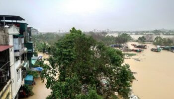 Hanoi flooded by swollen river as Typhoon Yagi leaves 179 dead