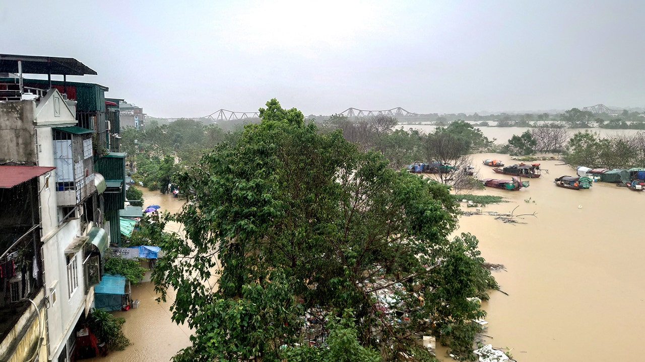 Hanoi flooded by swollen river as Typhoon Yagi leaves 179 dead