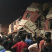 People surround two passenger trains which collided. Pic: AP