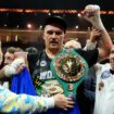 Oleksandr Usyk celebrates with the undisputed heavyweight title belt after his victory