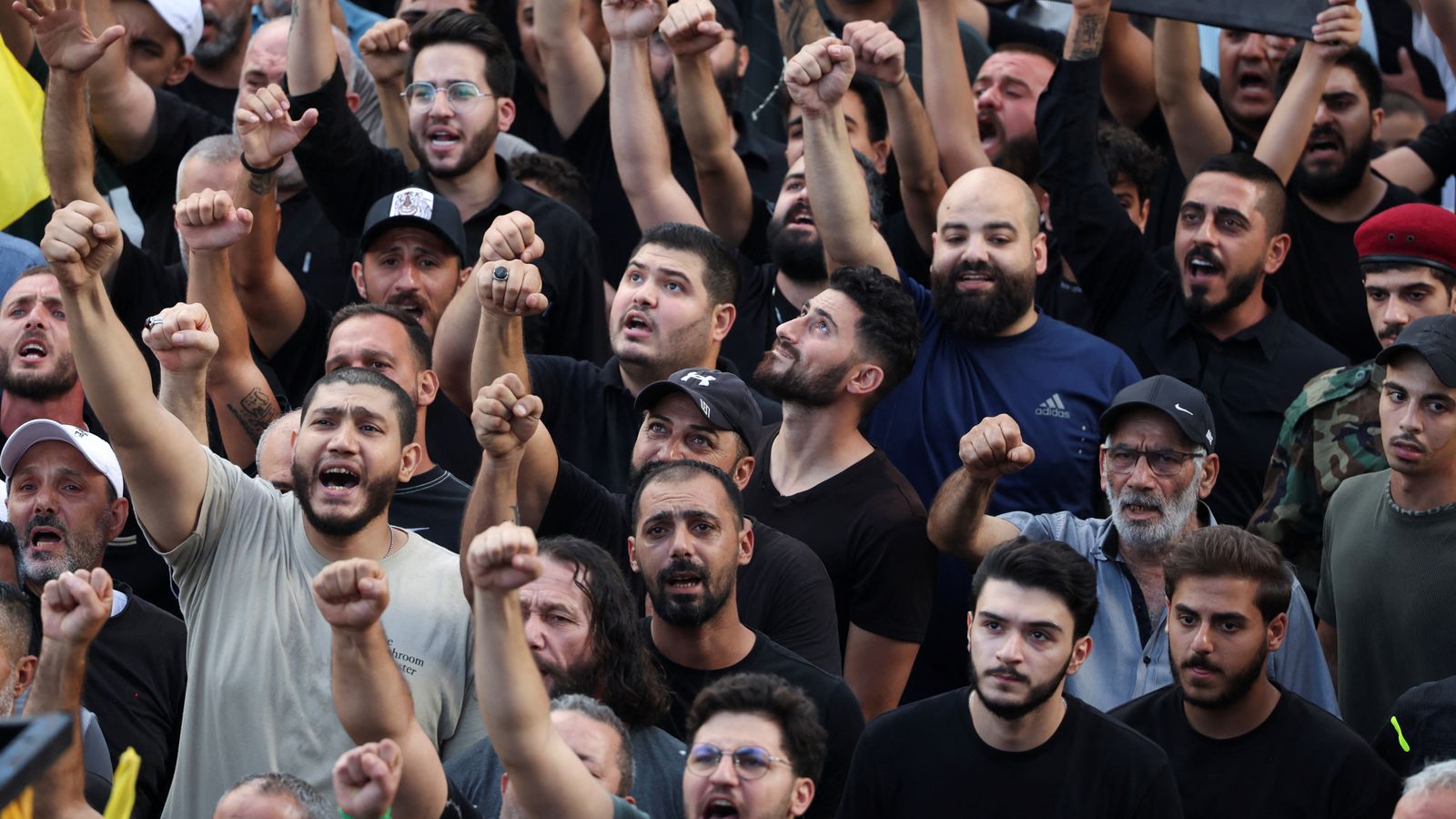 Men react as they attend the funeral for people who were killed amid the detonation of pagers across Lebanon, in Beirut, Lebanon September 18, 2024. REUTERS/Mohamed Azakir