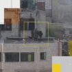 Video obtained by AP shows Israeli soldiers push bodies off the roof of a building in the West Bank. Credit: AP