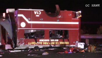 California firefighters remain hospitalized after truck flips over on freeway