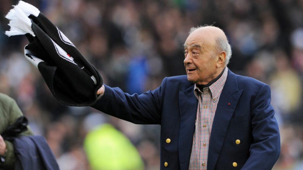 Mohamed al Fayed waves a Fulham scarf in front of supporters in 2012. Pic: Reuters