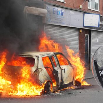 A car after it was set on fire by rioters in Middlesbrough on Sunday 4 August. Pic: PA