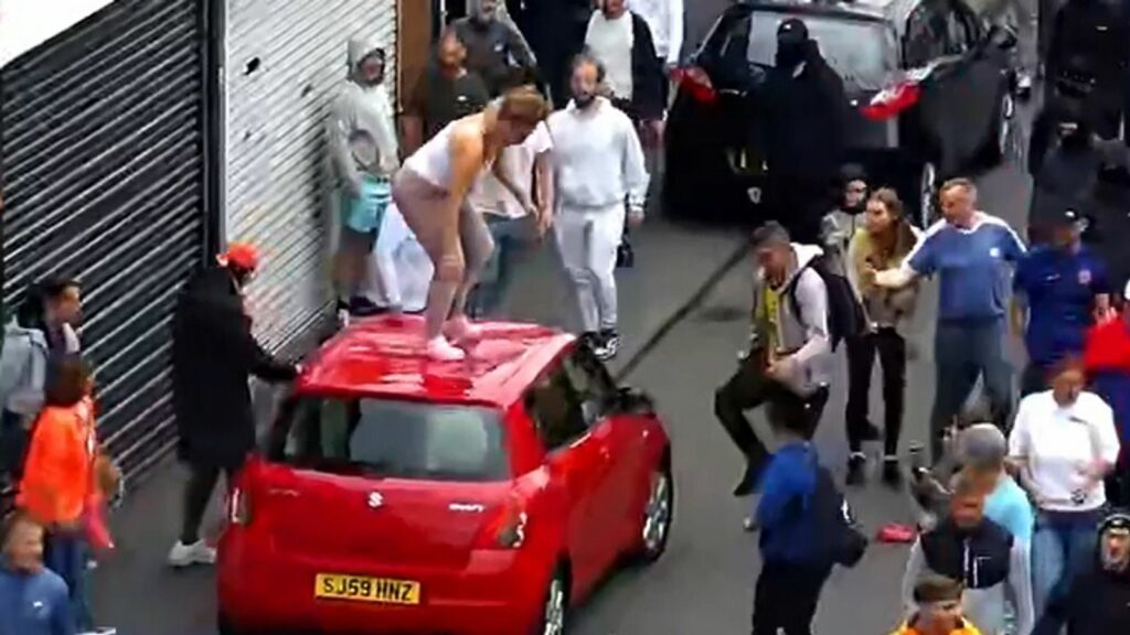 Megan Davison standing on top of a car. Pic: Cleveland Police