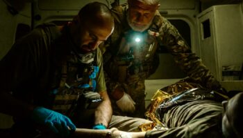 Yaroslav giving first aid in the ambulance. Pic: Alex Rossi