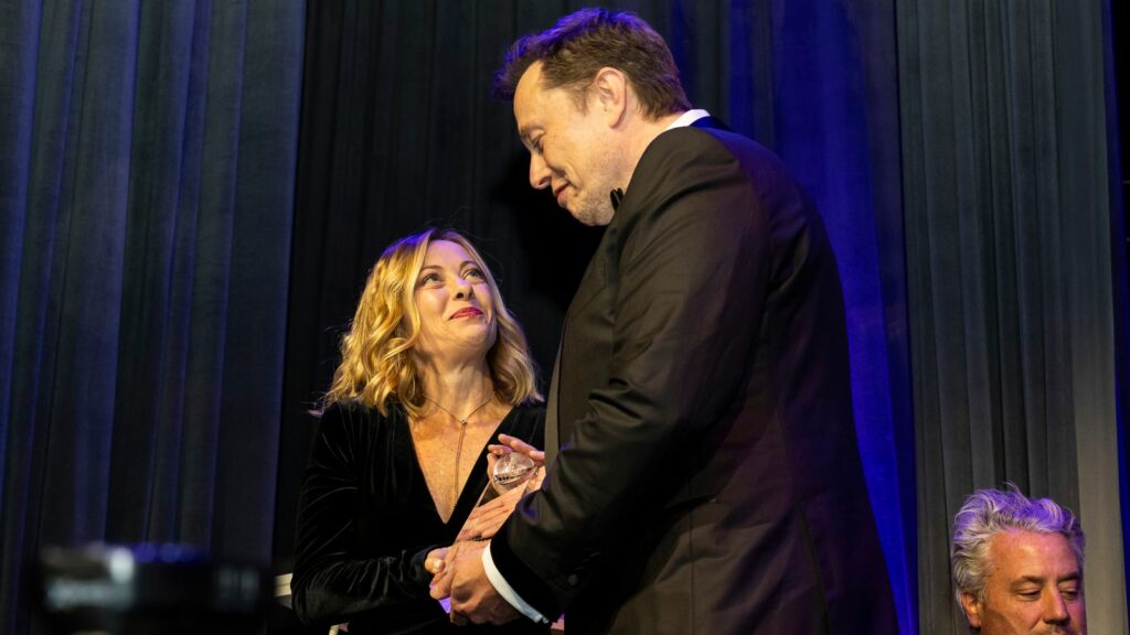 Elon Musk presents Giorgia Meloni with an award during the Global Citizen Awards dinner. Pic: AP