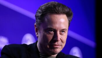 FILE PHOTO: Elon Musk, Chief Executive Officer of SpaceX and Tesla and owner of X looks on during the Milken Conference 2024 Global Conference Sessions at The Beverly Hilton in Beverly Hills, California, U.S., May 6, 2024. REUTERS/David Swanson/File Photo