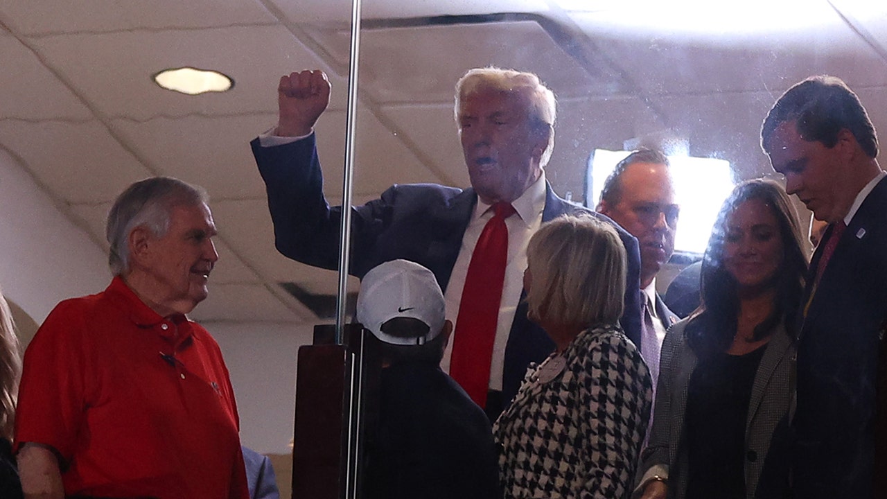 Trump arrives at Alabama-Georgia game to chants of 'USA,' 'Four more years'